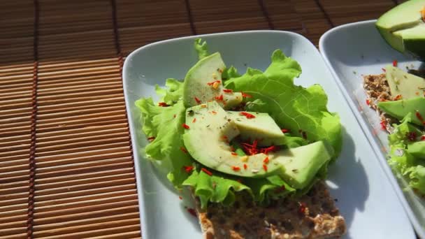 crispbread with salad and avocado top view. Healthy healthy Breakfast - Footage, Video