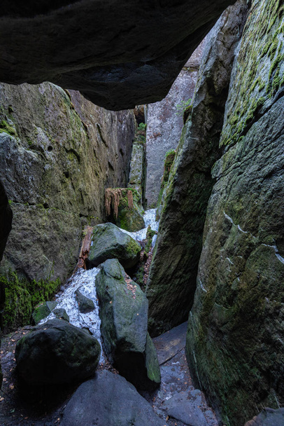 Stolowe Mountains National Park. Path in Rock Labyrinth hiking trail Bledne Skaly. Errant Rocks in Sudetes Mountains near Kudowa-Zdroj, Lower Silesia, Poland. - Photo, Image
