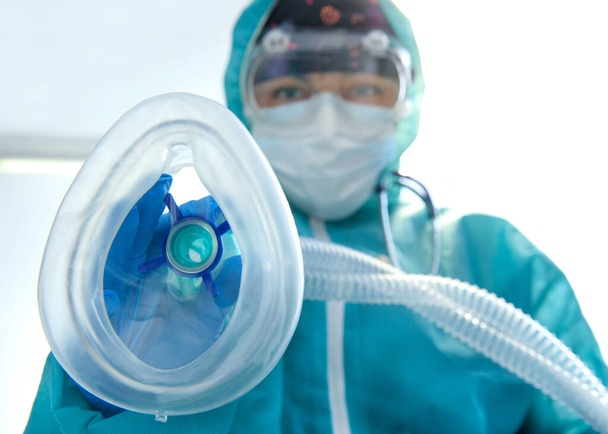 Doctors with protective suits in hospital, coronavirus concept, Doctor in hospital looking at camera, Corona virus, Covid-19, virus outbreak, medical mask, hospital, quarantine or virus outbreak concept - Photo, Image