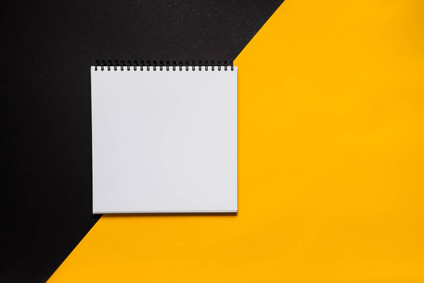 Mockup planner flat lay, top horizontal view yellow background. Notepad and notebooks with stationery. Golden, white and black colors. Back to school, education concept. - Foto, immagini