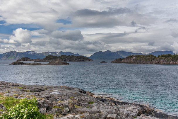 Lofoten Summer Landscape Lofoten is an archipelago in the county of Nordland, Norway. Is known for a distinctive scenery with dramatic mountains and peaks. selective focus - Foto, Imagen