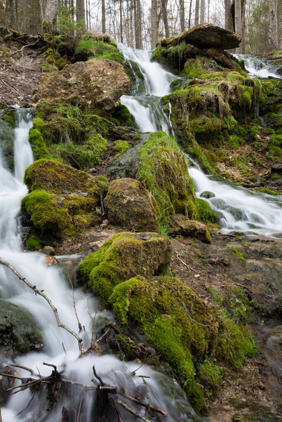 City Cesis, Latvia. Old waterfall with green moss and dolomite rocks.19.04.2020 - 写真・画像