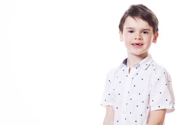 Young cute happy little boy posing on white background.  - Photo, Image