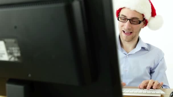Hombre de negocios de Santa frente a una computadora
 - Metraje, vídeo