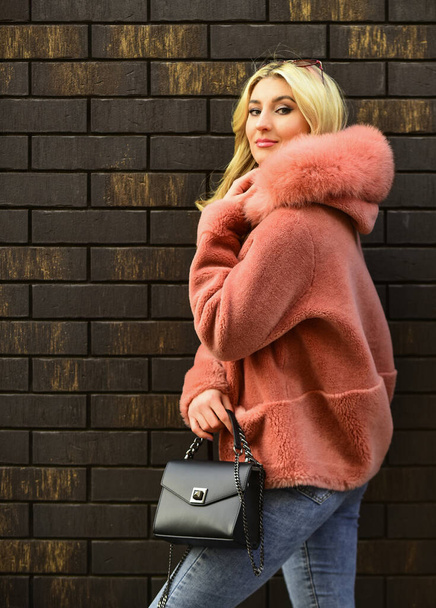 Pink sheepskin coat. Fancy chic coat. Natural wool sheepskin coat. Fur on hood. Stay warm and fashionable. Glamorous lady. Woman wear furry coat. Winter clothes. Fashion as unique as you are - Fotó, kép