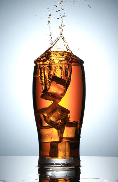 Cold Drink Splash with Ice Cubes - Foto, Imagen