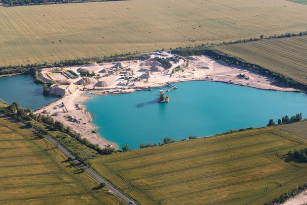 Sand quarry in Slovakia. Production near Bratislava. View from the plane in the spring. - Foto, Imagen