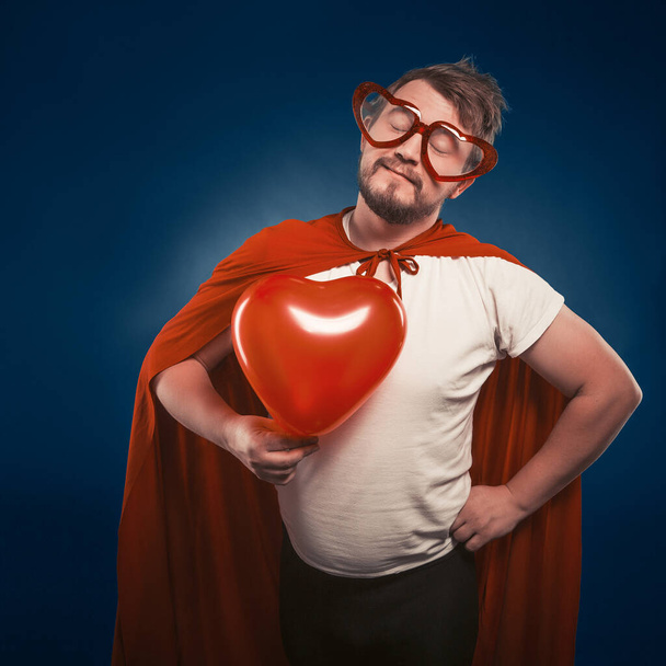 Superhero Man In Love Holding Big Heart In His Hand, Valentines Day Concept - Valokuva, kuva