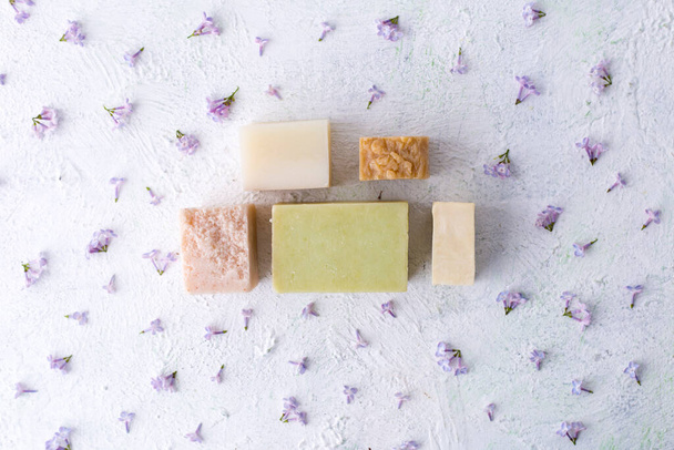 Pieces of natural soap with flowers. Skin care. Health and beauty.  - Foto, afbeelding