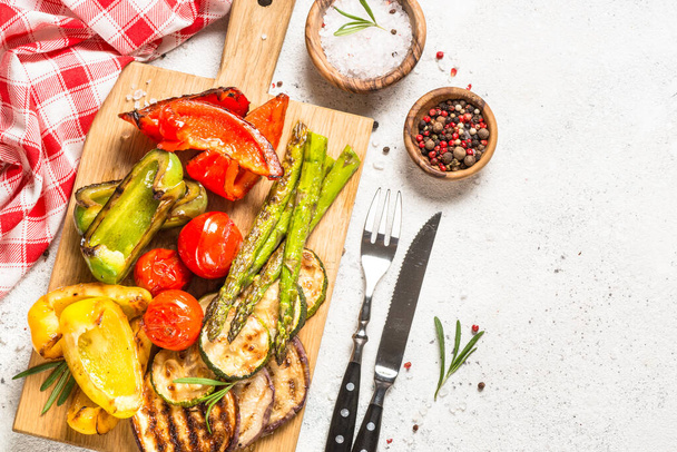 Grilled vegetables - zucchini, paprika, eggplant, asparagus and tomatoes. - Фото, изображение
