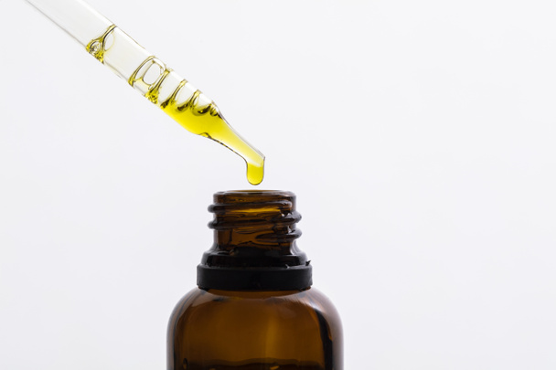Close up of CBD oil in a dropper bottle - Фото, изображение