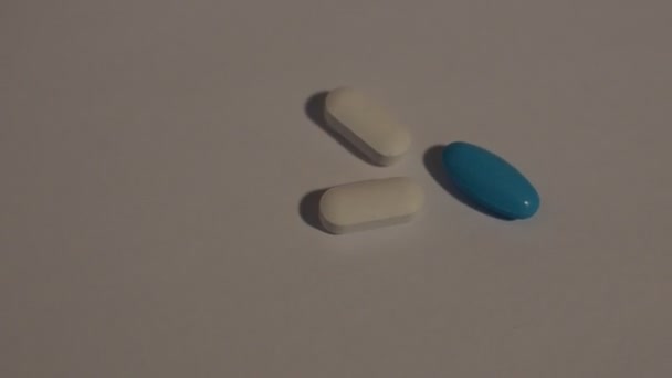 Pills on a light background - Felvétel, videó