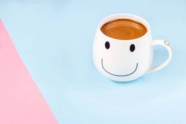 Black coffee in a white mug on a pink and blue background - Photo, Image