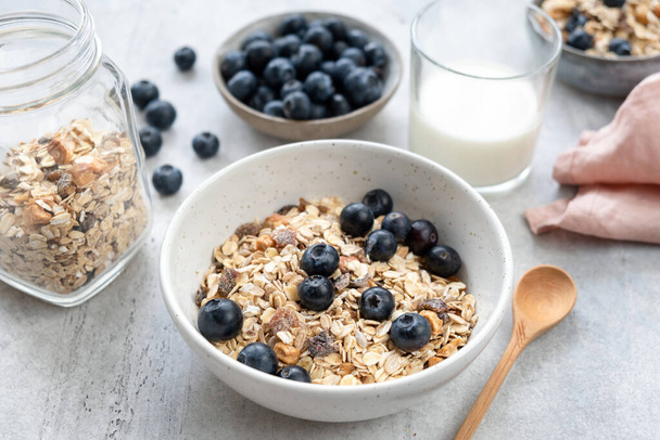 Breakfast cereals in bowl served with almond milk - Foto, Imagen