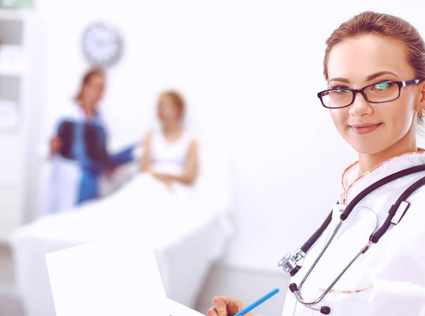 Woman doctor standing at hospital - Фото, изображение