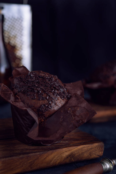 Chocolate muffin on dark background - Φωτογραφία, εικόνα