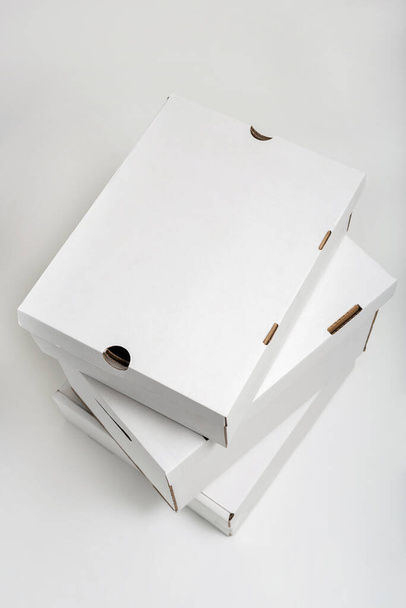 Pile of blank white shoe boxes. View from above - Foto, Imagem