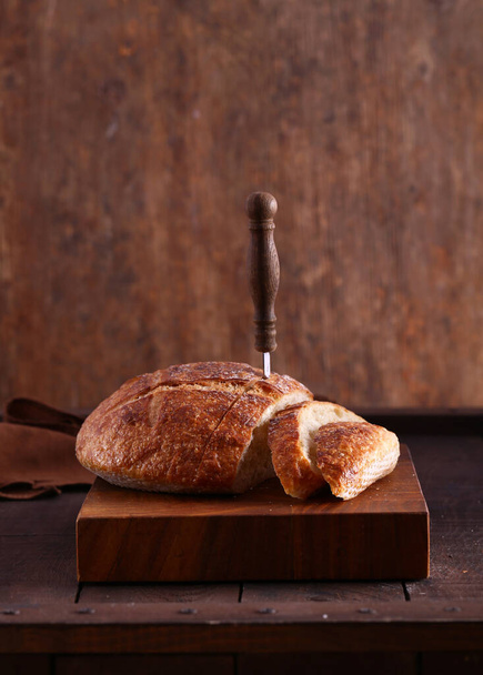 homemade whole grain bread on a wooden table - Foto, Bild