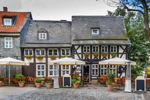 Street with old half-timbered house in Goslar, Germany - Fotó, kép