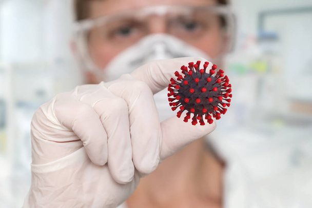 Жінка-науковець, що тримає Corona Virus - COVID-19 в пальцях - Фото, зображення
