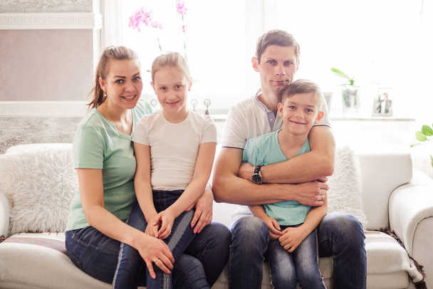 Happy family posing together, smiling and looking at the camera. Horizontal photo - Fotoğraf, Görsel