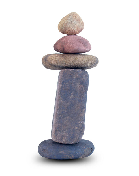Small stones that are stacked in balance vertically isolated on white background with clipping paths for graphic design. In the concept of meditation or to calm the mind in Zen doctrine - Photo, Image