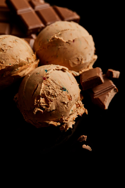 fresh delicious chocolate ice cream isolated on black - Foto, Imagen