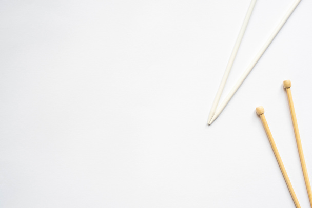 top view of knitting needles on white background - Fotografie, Obrázek