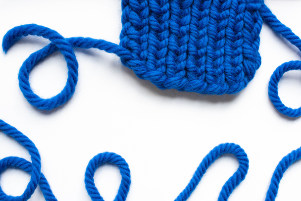 top view of blue wool thread on white background - Valokuva, kuva