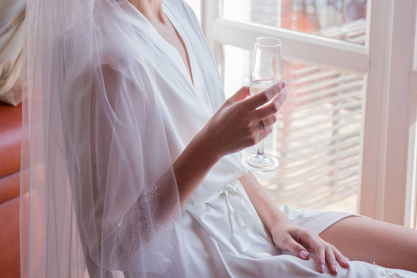 bride in peignoir in the morning in room - Foto, Imagem