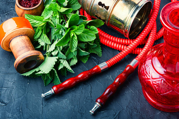 Asian smoking shisha with tobacco with mint.Turkish tobacco hookah with spearmint.Details of a hookah. - Fotoğraf, Görsel