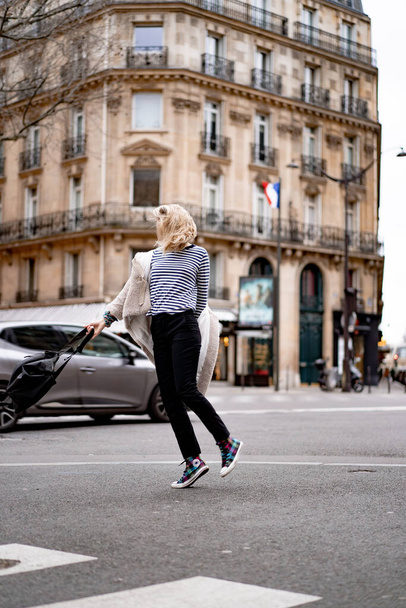 Young beautiful woman outdoors in Paris. Travel concept. Funny photos - 写真・画像