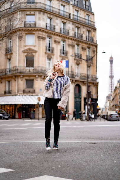 Young beautiful woman outdoors in Paris. Travel concept. Funny photos - Fotó, kép