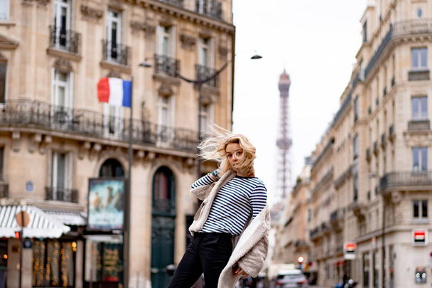 Young beautiful woman outdoors in Paris. Travel concept. Funny photos - Photo, image
