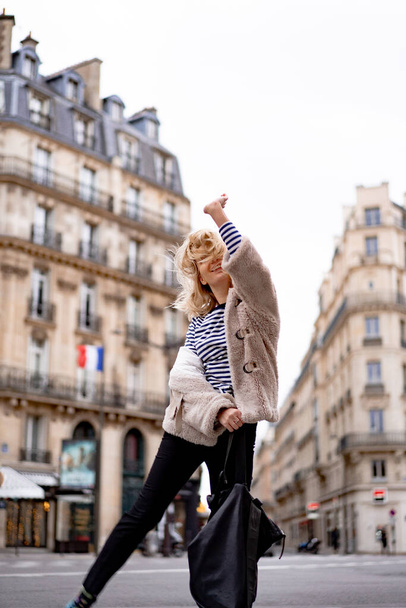 Young beautiful woman outdoors in Paris. Travel concept. Funny photos - Φωτογραφία, εικόνα