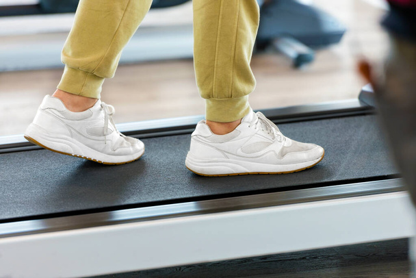 Man exercising on a treadmill in the gym - Фото, зображення