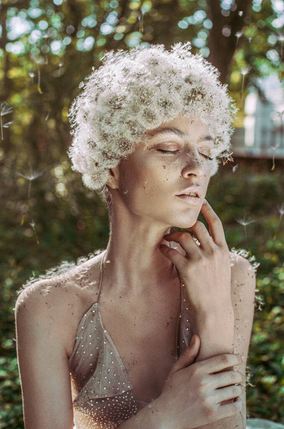 Beautiful woman with dandelion head beauty - Фото, изображение