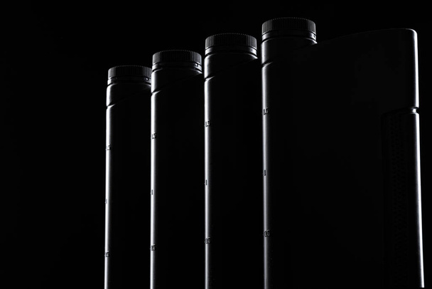 Engine oil bottle on black background, close up. - Photo, Image