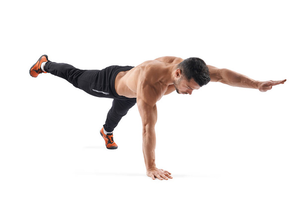 Fit man stretching, isolated on white. - Fotó, kép