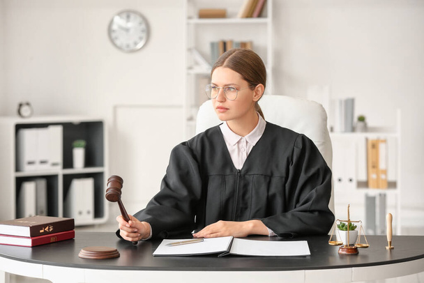 Female judge working at table in office - Foto, Imagem