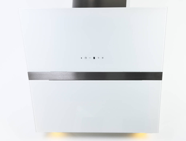Close-up of a touch control panel on a white glass kitchen hood.White inclined cooker hood. Simple light modern kitchen design - Foto, afbeelding