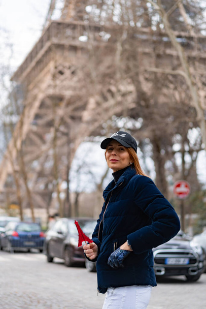 young beautiful stylish woman on a eiffel tower in Paris. eiffel tower candy - Fotografie, Obrázek