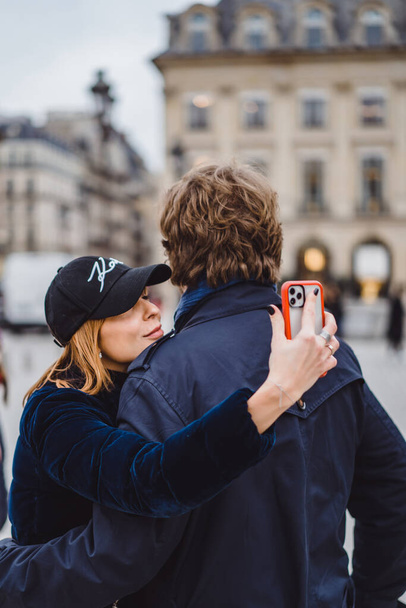 Loving couple on the street hugs and kisses. Paris. - Фото, зображення