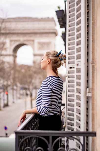 Attractive young woman on balcony in the morning in city Paris - Fotografie, Obrázek