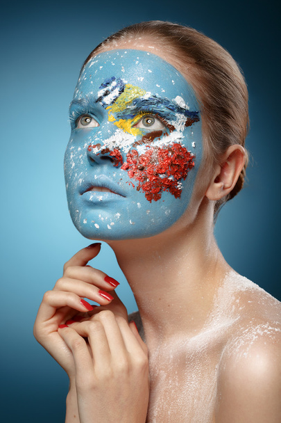 Beautiful fashion model with face art in winter style. Textural - Photo, image
