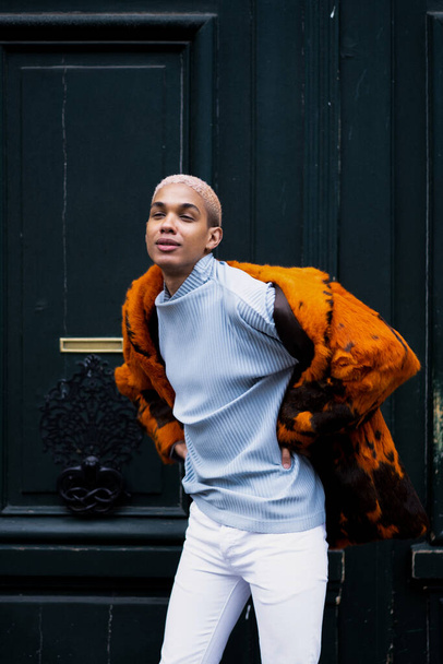 Young handsome african american man posing outdoors in Paris. happy smile, fashion style. - 写真・画像