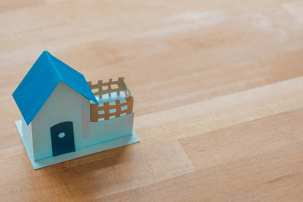 A blue house with copy space.Home loan  ,mortgage or refinance concept.Cottage icon. - 写真・画像
