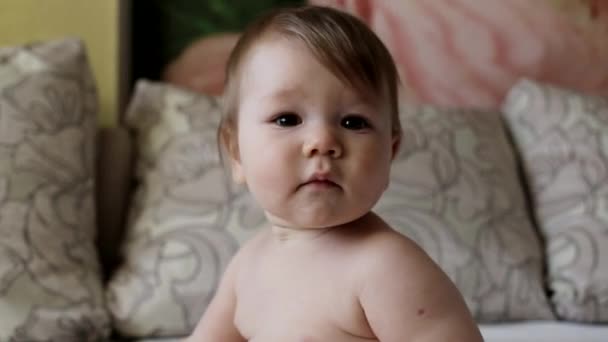 Naked plump caucasian boy infant looking at the camera, handsome - Materiał filmowy, wideo