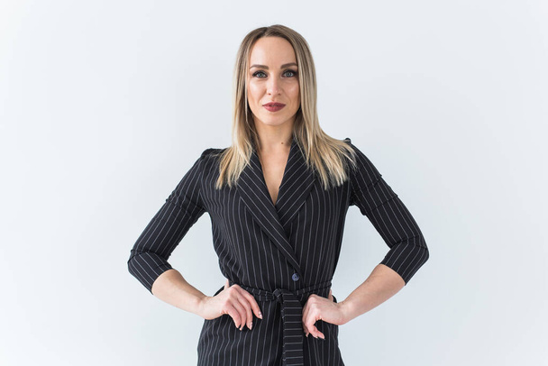 Fashion concept - Portrait of sexy business woman in a suit on white background. - Φωτογραφία, εικόνα