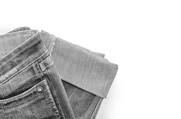 Black jeans is on a white background. Clothes for donations. Fragments of clothing. - Foto, Imagem